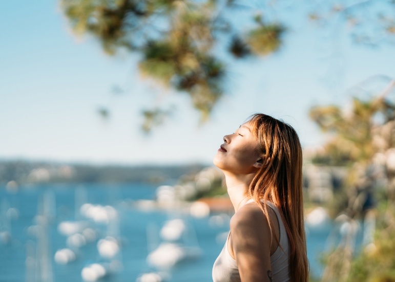 Person feeling overwhelmed by summer stress